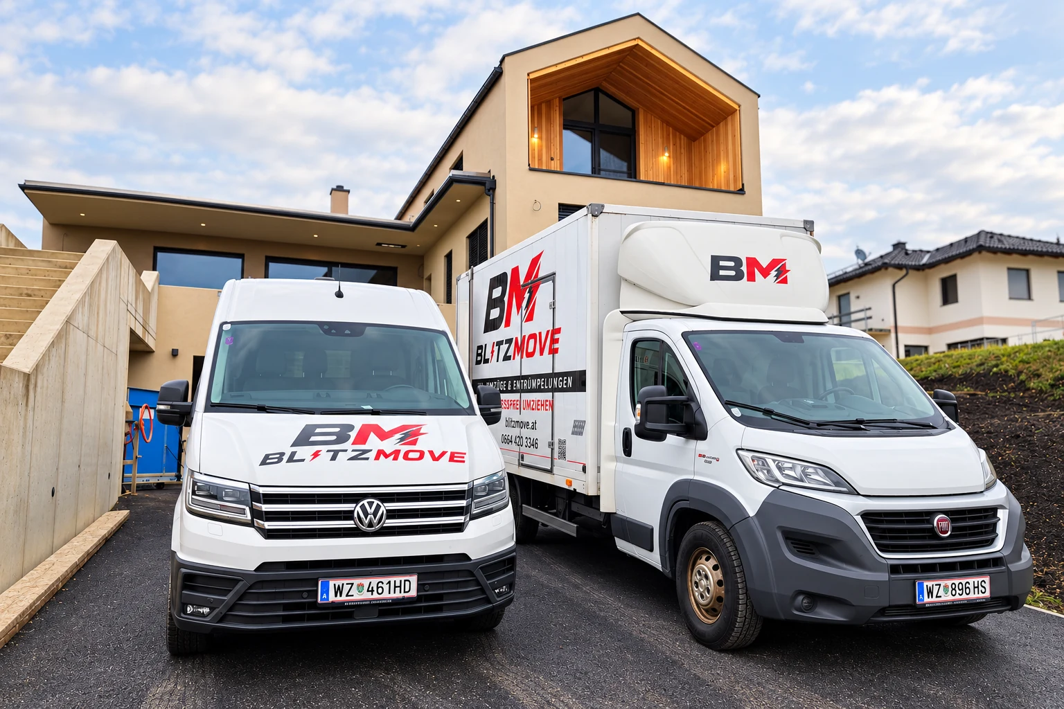 Zwei BlitzMove Umzugsfahrzeuge vor einem Wohnhaus